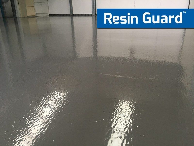 A low-angle photo of a Resin Guard floor in a factory showing the semi-gloss finish of the protective rollcoat system.