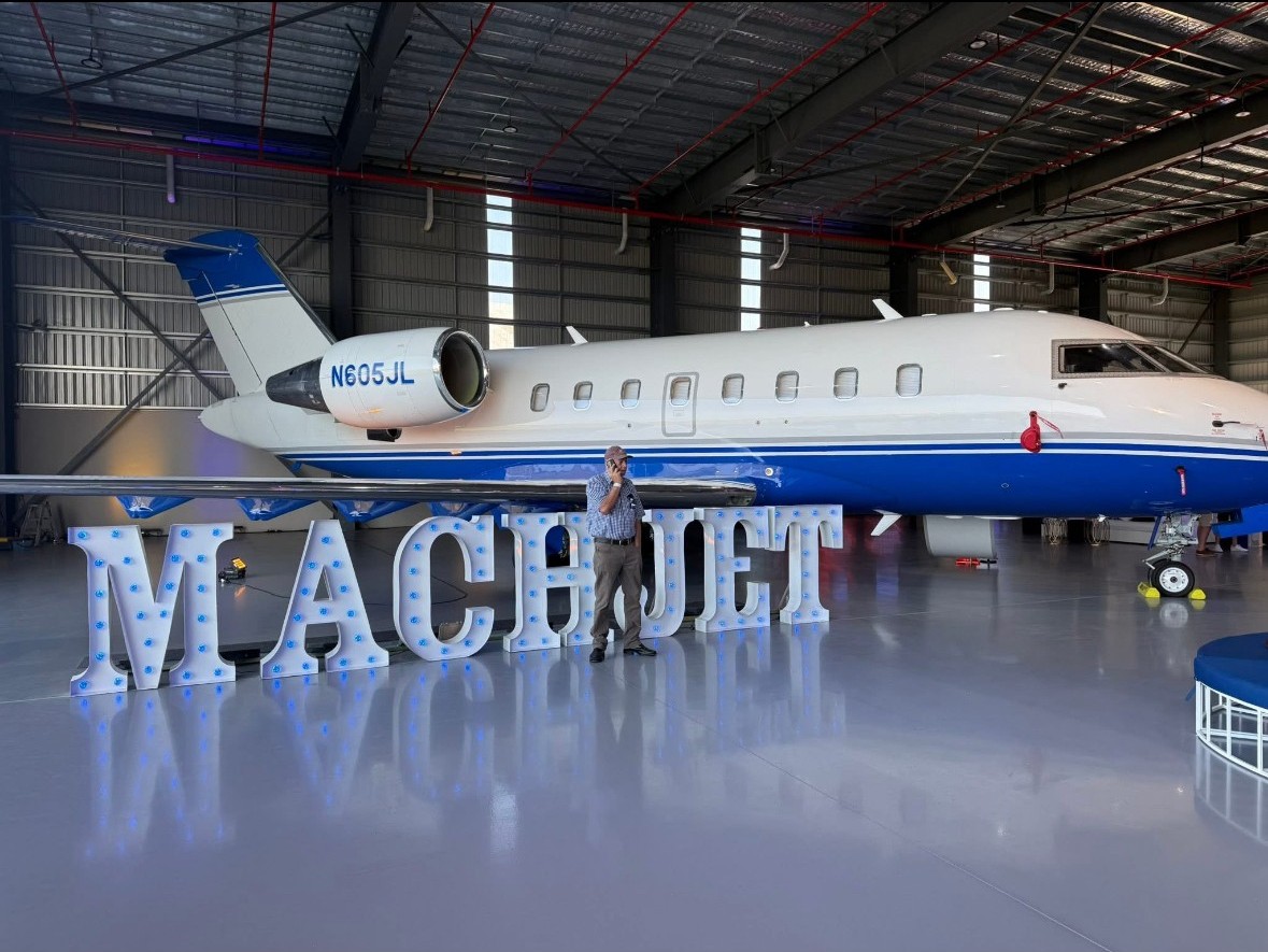 A view from inside the empty warehouse looking back towards the entrance with the new protective epoxy floor in the foreground.