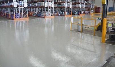 The Resin Guard system installed at the front of a large warehouse with pallet racking bays in the background.