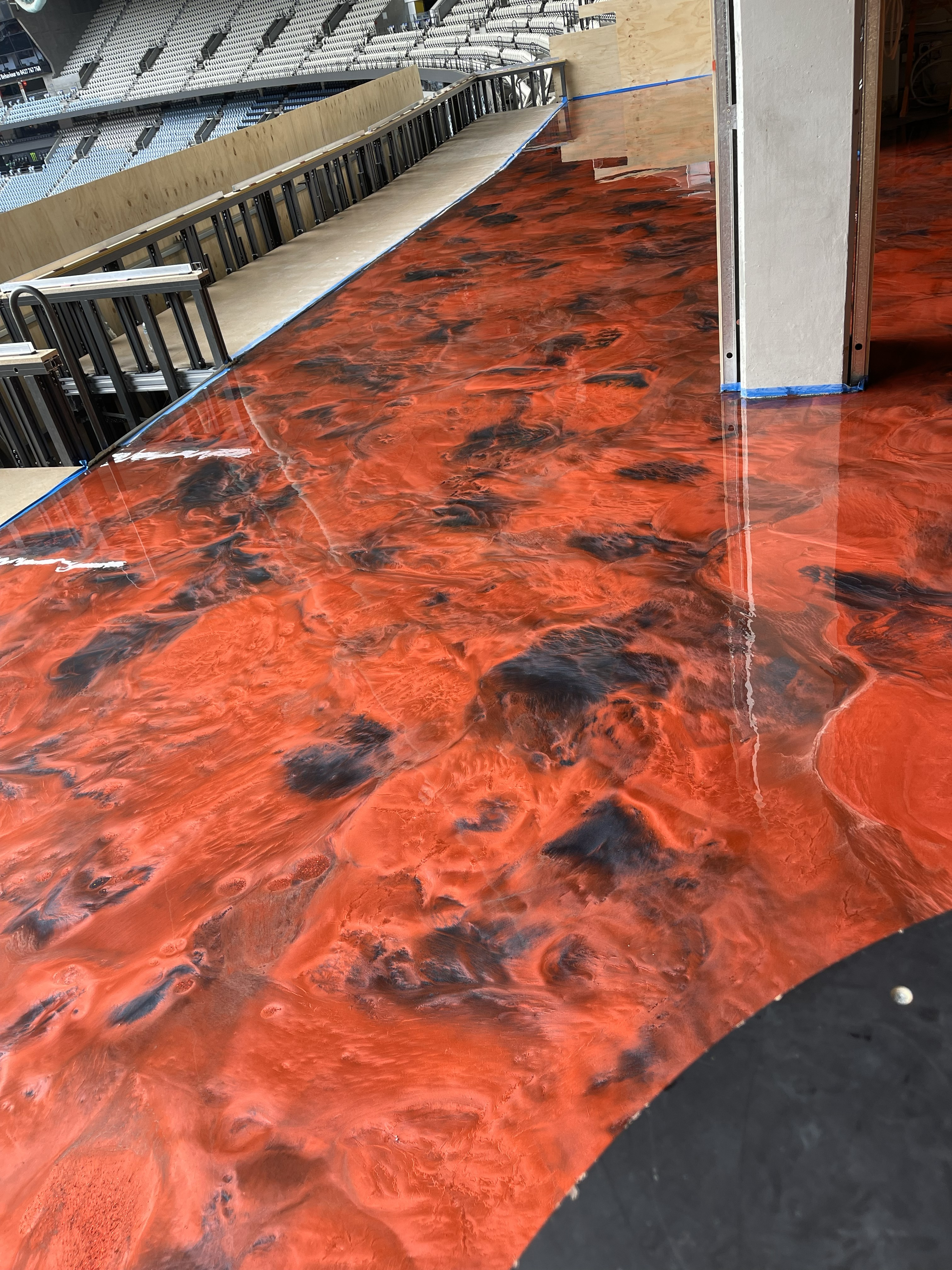 A photo taken from the back of the cafe looking towards the entrance, showing the clean, modern look the new silver metallic epoxy floor provided.
