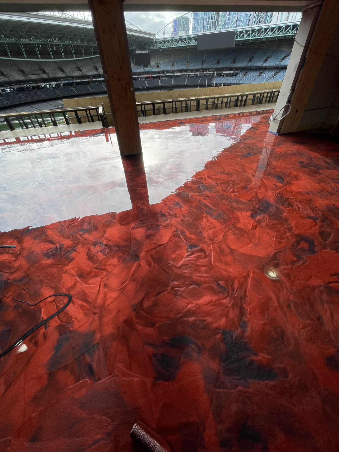 A photo taken from the cafe entrance looking into the cafe, with the seating area in the background and a decorative wooden barrel in the left foreground.
