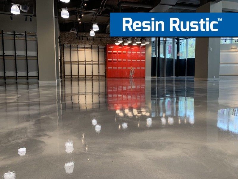 A low-angle photo of a Resin Rustic floor in a retail outlet showing the glossy standard finish of the decorative epoxy flooring system.