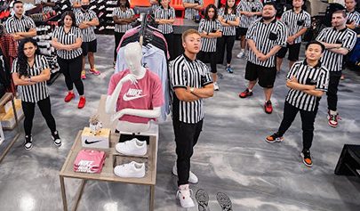 Foot Locker employees posing for a group photo while standing on a new Resin Rustic floor.