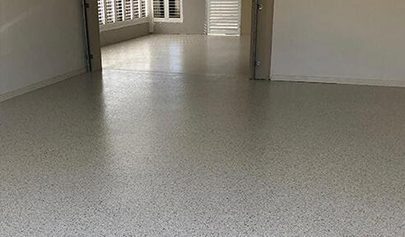 The Resin Vinyl system installed throughout a large residential garage, including a sunroom that leads to the entrance of the house.