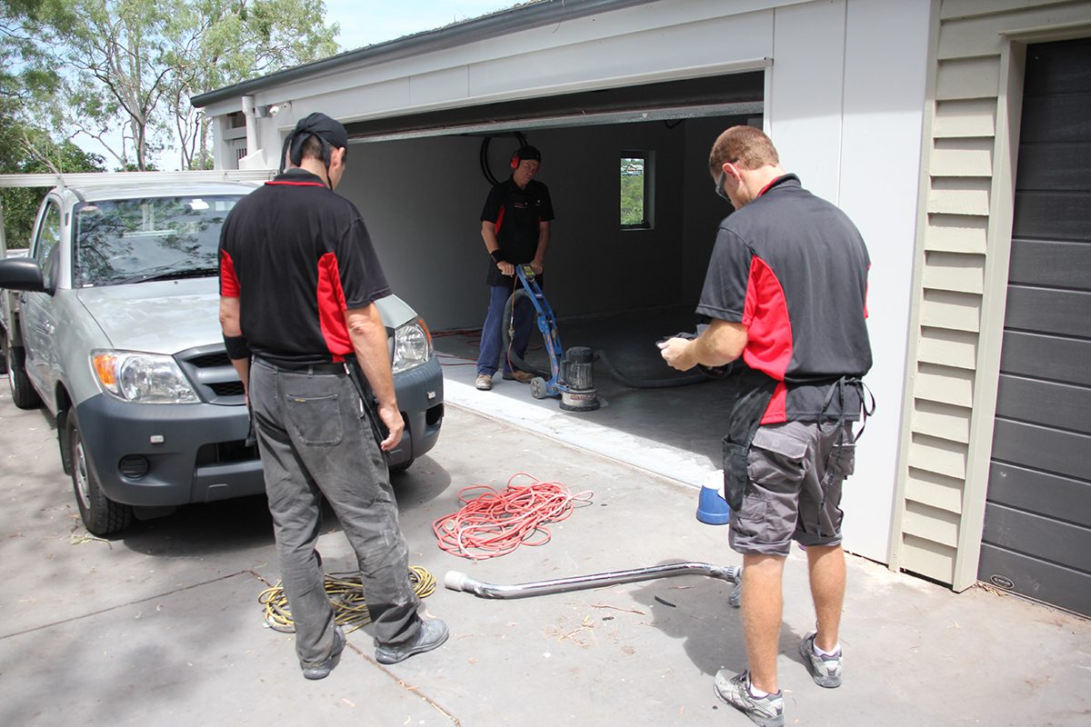 An epoxy flooring business with three employees getting ready to install an epoxy floor.
